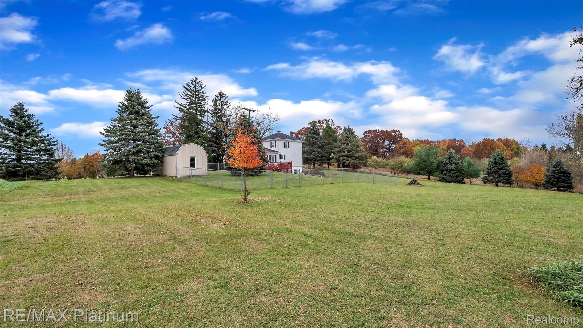 5240 Bentley Lake Road Howell, MI 48843 - Photo 2 of 30 Big Back Yard With Partially Fenced In Area...Lots of Room To Run And Play
