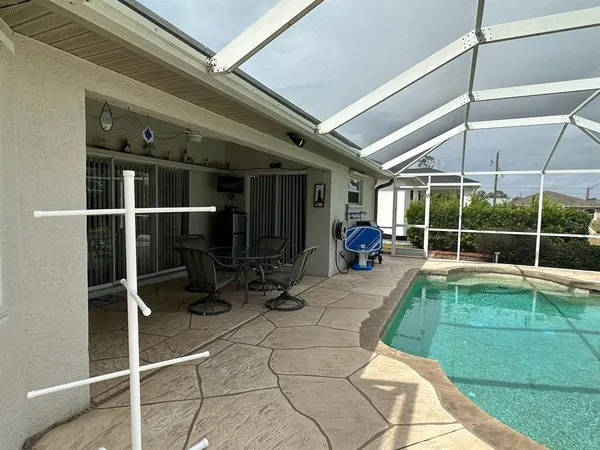a view of a backyard with sitting area and furniture