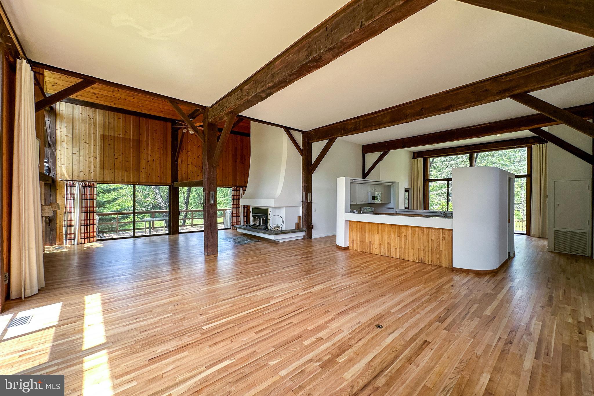 900 Canal Road Princeton, NJ 08540 - Photo 11 of 38 a view of an empty room with wooden floor and a window