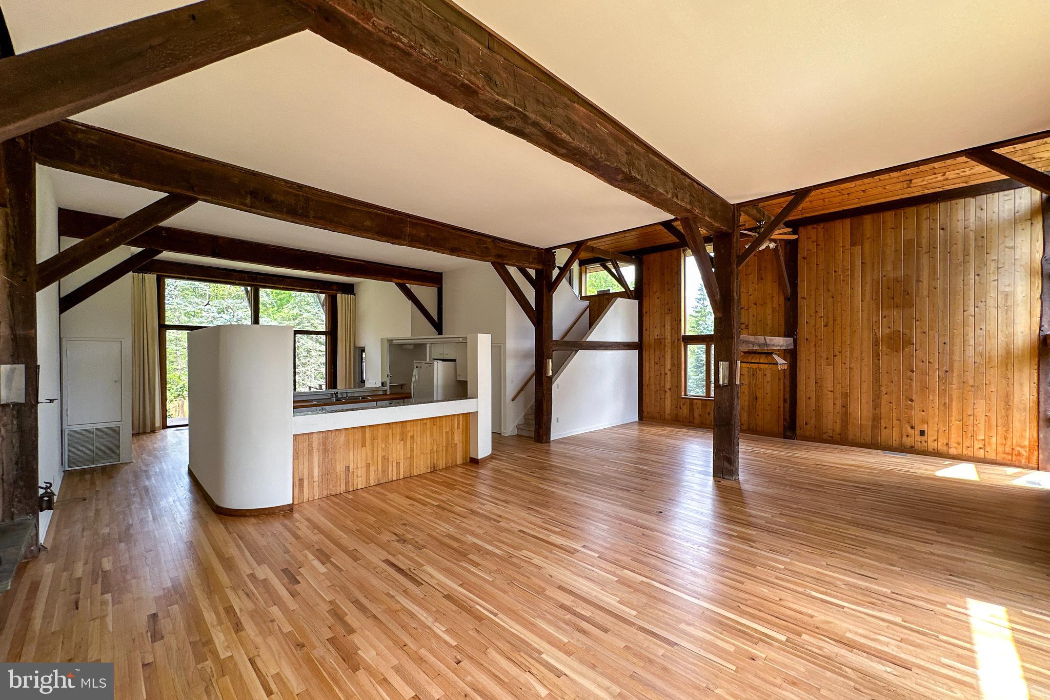 900 Canal Road Princeton, NJ 08540 - Photo 12 of 38 a view of an empty room with wooden floor and a window