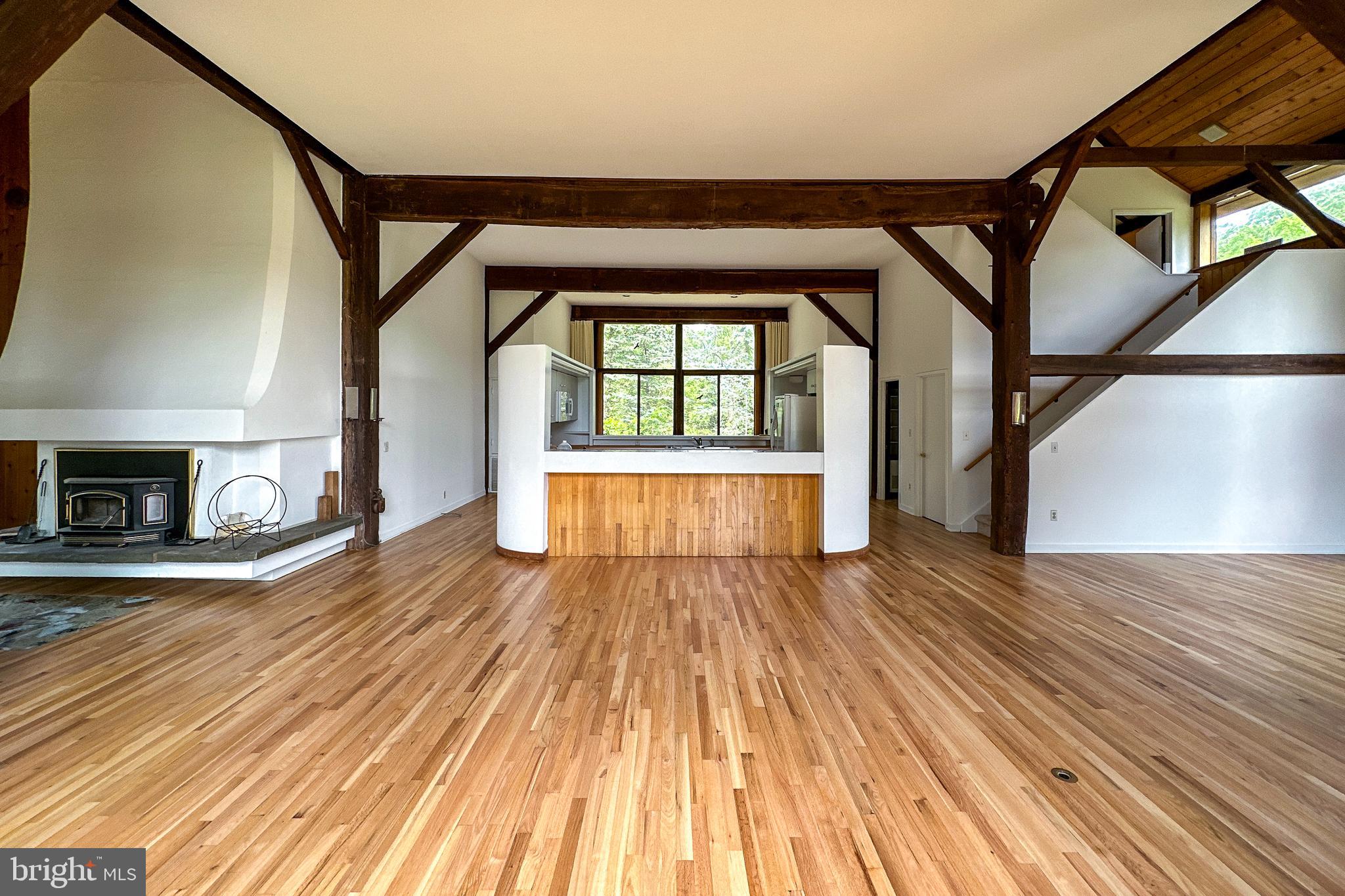 900 Canal Road Princeton, NJ 08540 - Photo 13 of 38 a view of empty room with wooden floor and fireplace