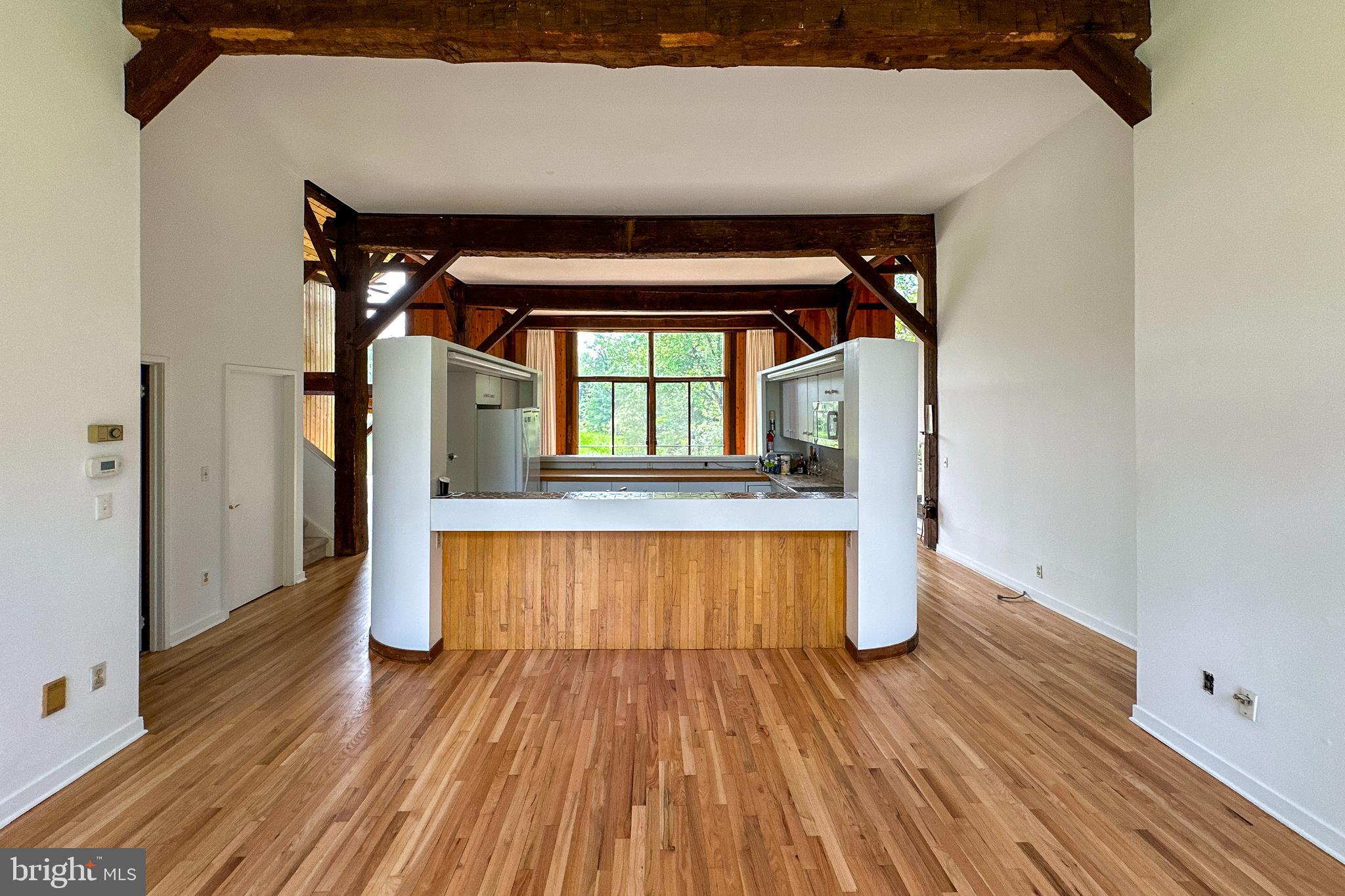 900 Canal Road Princeton, NJ 08540 - Photo 14 of 38 wooden floor in an empty room with a window