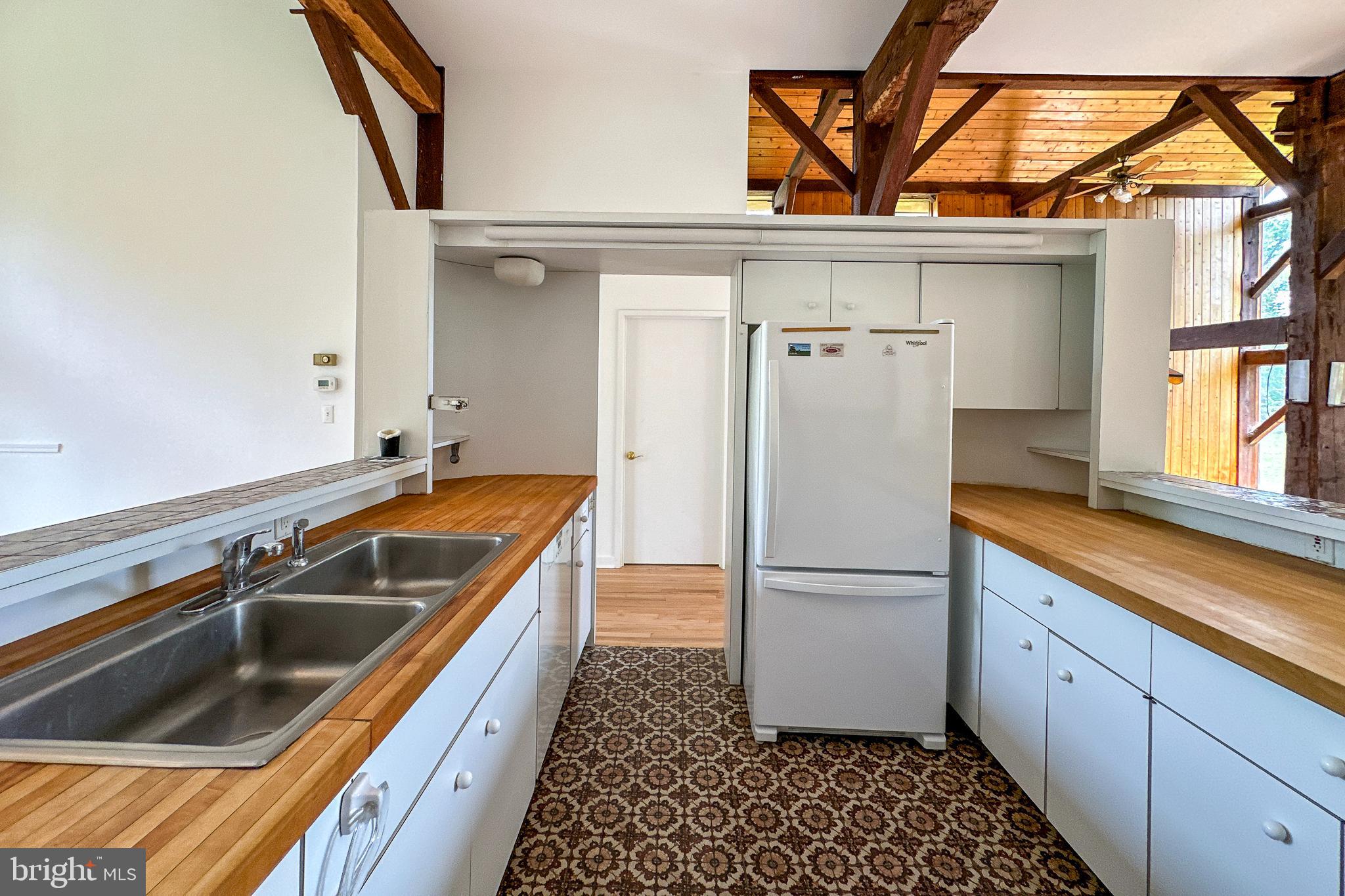 900 Canal Road Princeton, NJ 08540 - Photo 17 of 38 a kitchen with a refrigerator and a sink