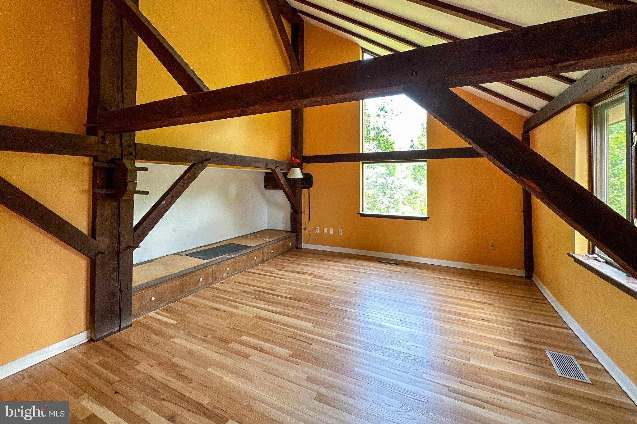 900 Canal Road Princeton, NJ 08540 - Photo 22 of 38 a view of an empty room with wooden floor and a window