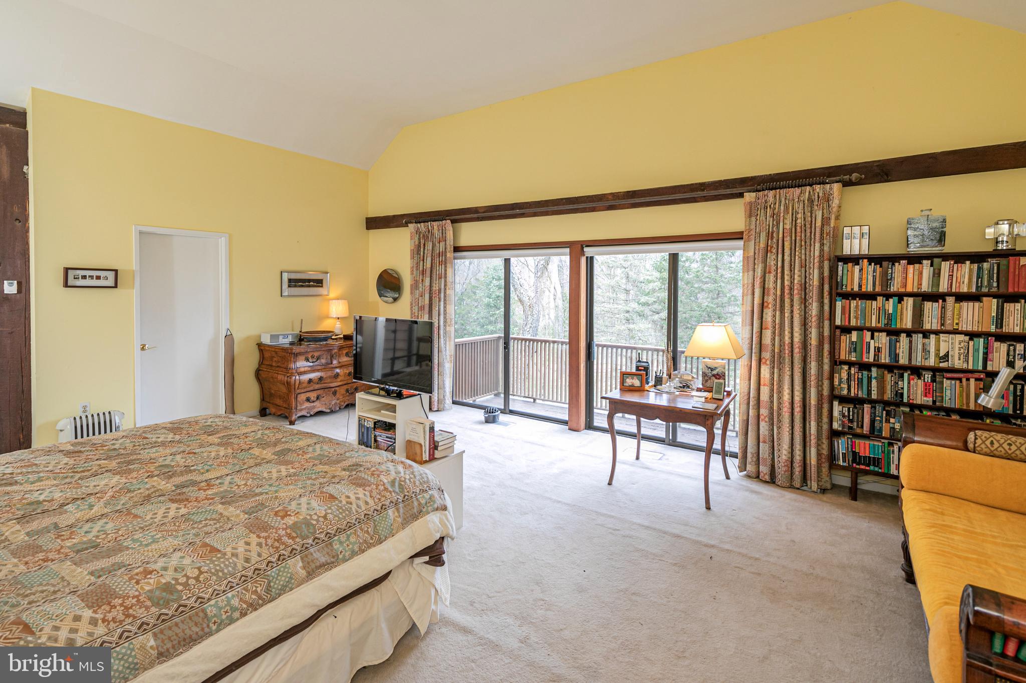 900 Canal Road Princeton, NJ 08540 - Photo 23 of 38 a bedroom with a large bed and a large window with outer view