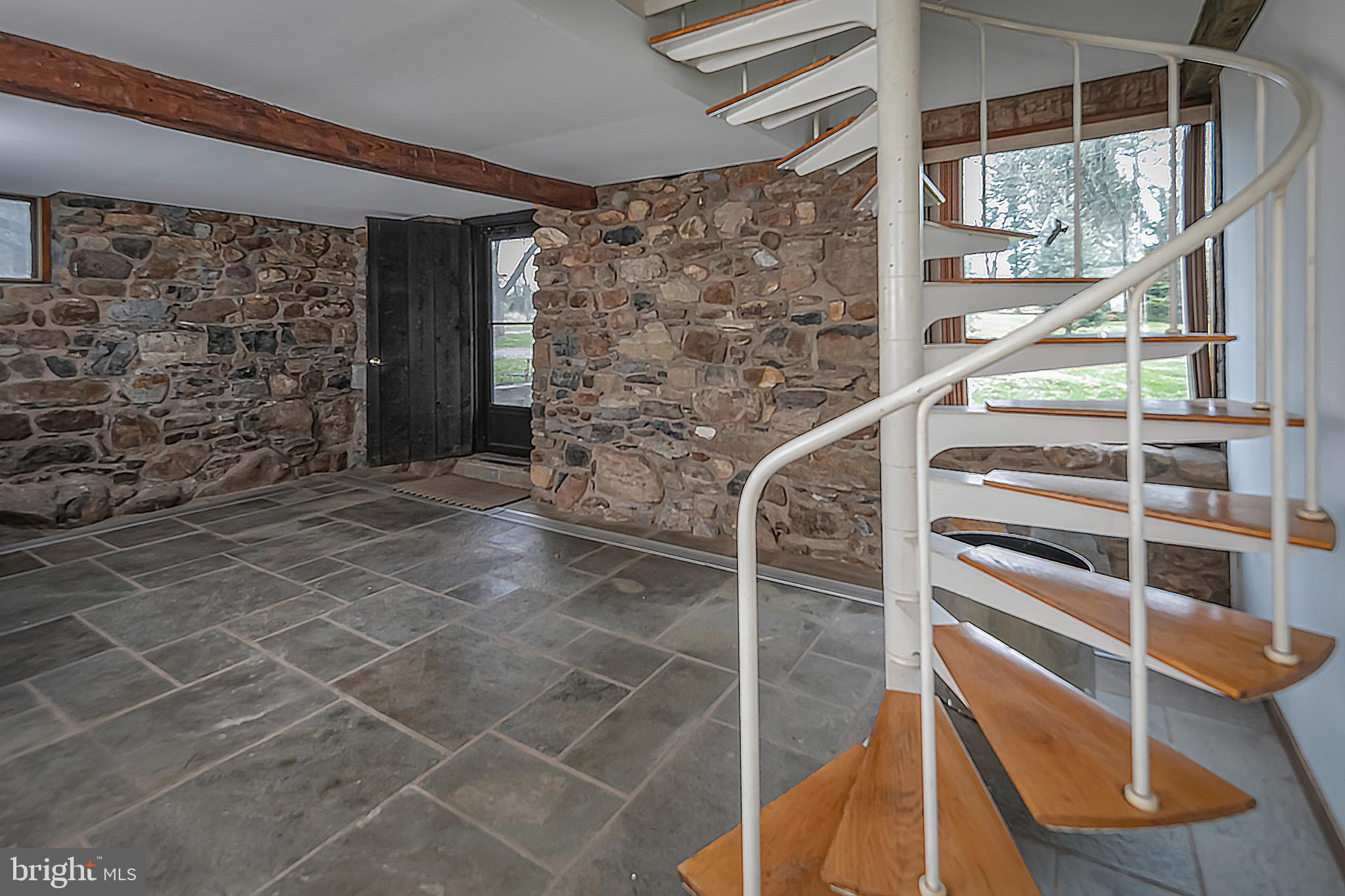 900 Canal Road Princeton, NJ 08540 - Photo 26 of 38 a view of an empty room with wooden floor and windows