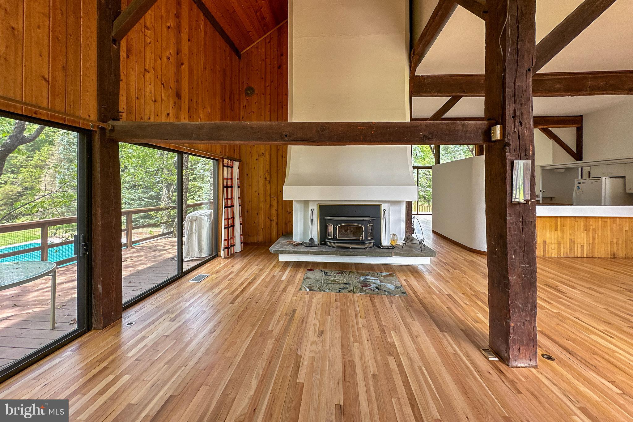 900 Canal Road Princeton, NJ 08540 - Photo 10 of 38 an empty room with wooden floor windows and outdoor view