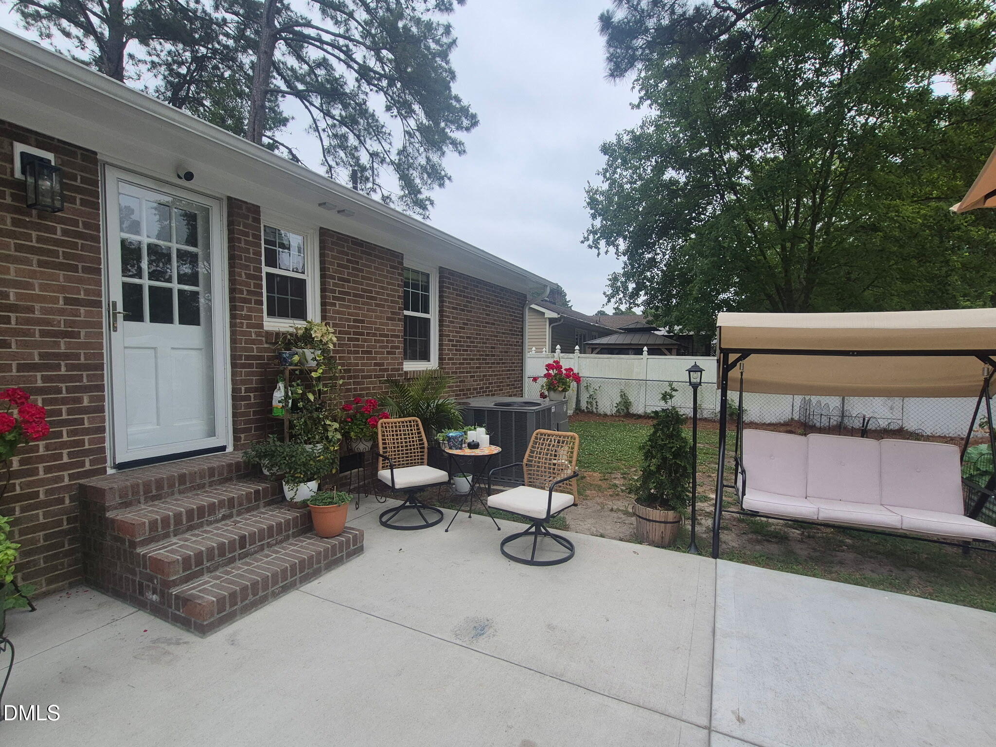 1219 Queen Anne Road Northwest Wilson, NC 27896 - Photo 10 of 26 a view of backyard with outdoor seating and trees