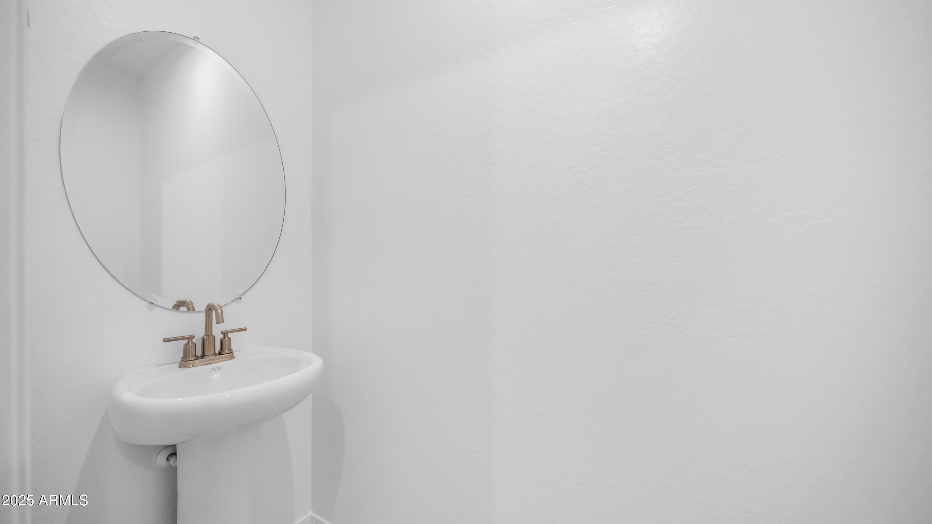 13362 West Eagle Feather Road Peoria, AZ 85383 - Photo 9 of 32 a bathroom with a sink and a mirror
