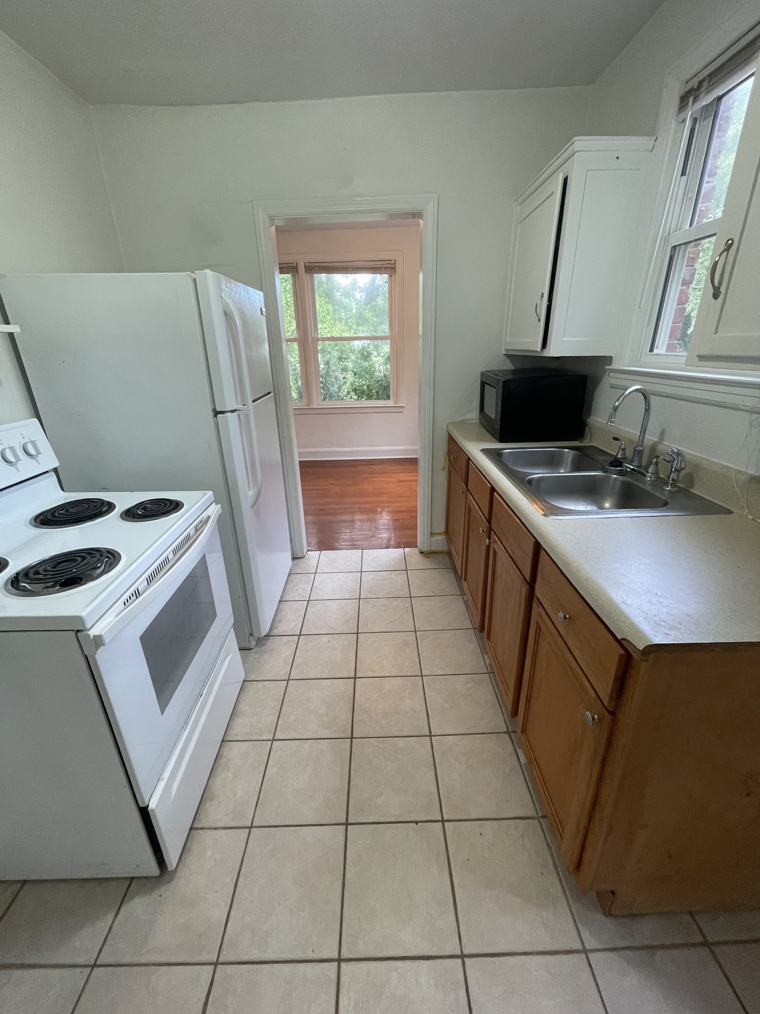 3452 Mt Tabor Road Murfreesboro, TN 37127 - Photo 3 of 5 a kitchen with a stove top oven and cabinets