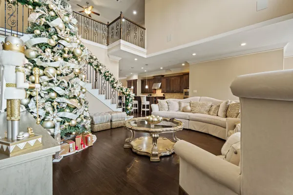 a living room with furniture and a chandelier