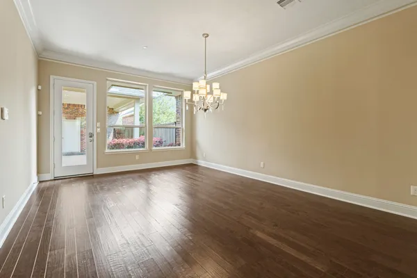 a view of a room with window and wooden floor