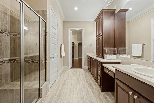 a spacious bathroom with a granite countertop sink mirror and double
