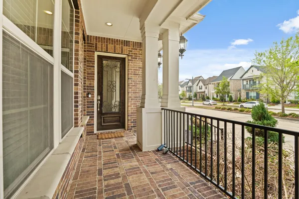 a view of a balcony with wooden floor