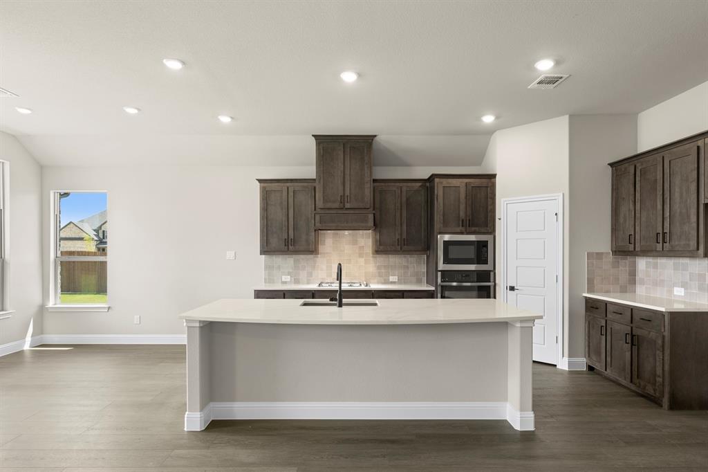 238 Harmony Avenue Forney, TX 75126 - Photo 4 of 27 DFW-Lovers Landing-Concept 2267-238 Harmony Avenue-Kitchen-Risewell Homes