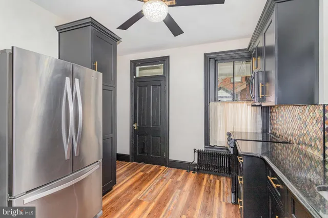 a kitchen with stainless steel appliances a refrigerator and a sink
