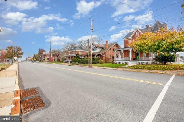 a view of a street with cars on city street