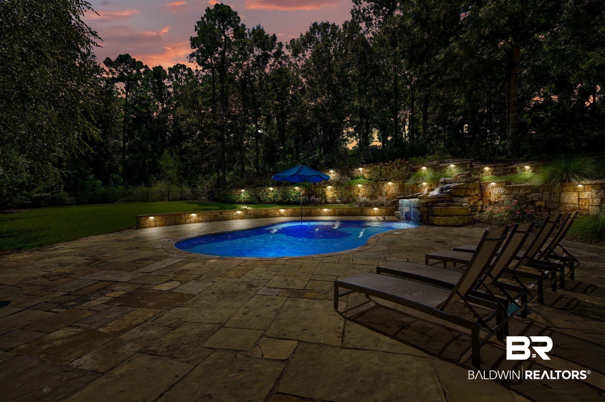 30057 Dolive Ridge Daphne, AL 36527 - Photo 40 of 55 Pool at dusk with a patio area and pool water feature