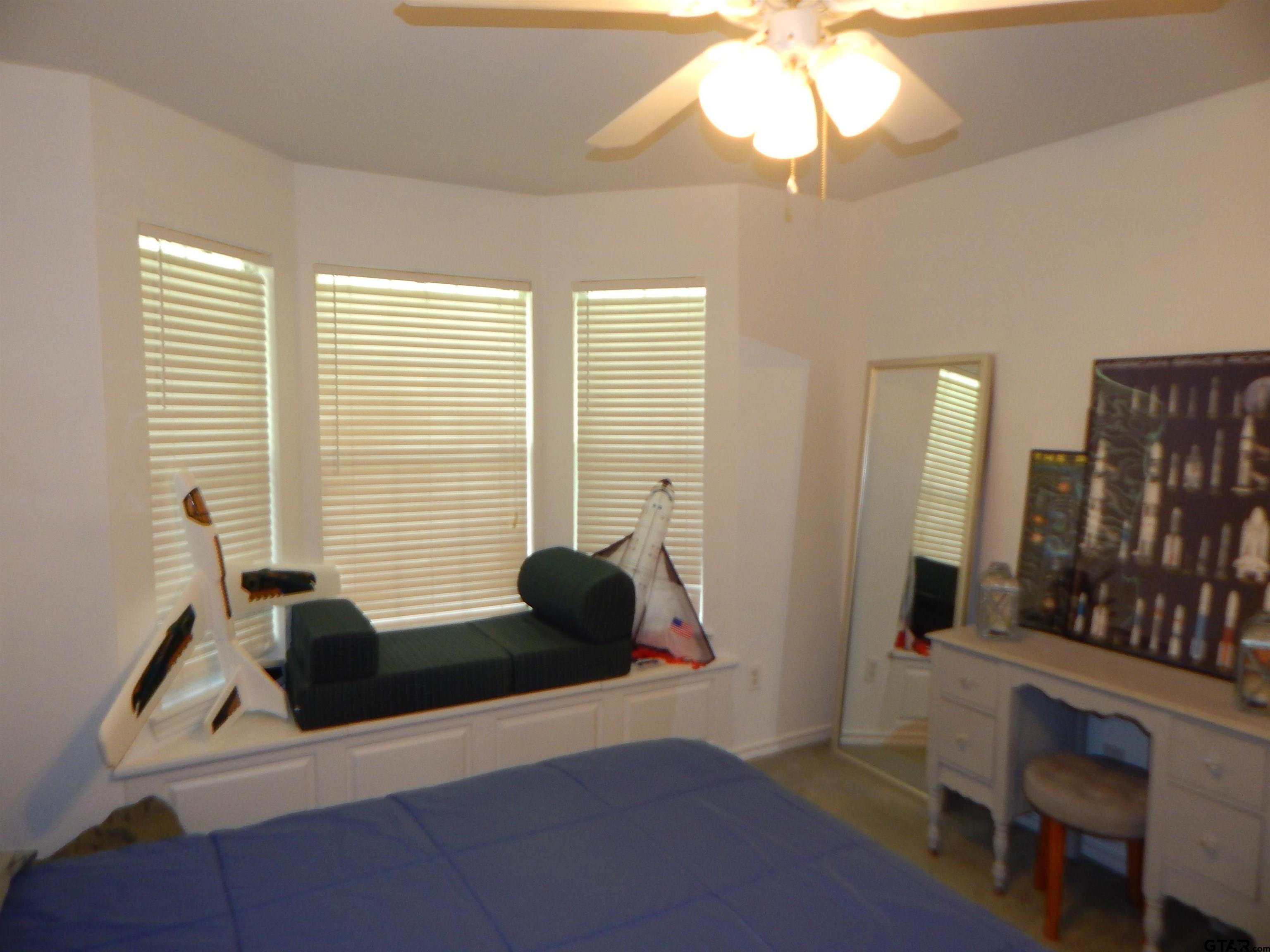 1106 Tall Timbers Road Gilmer, TX 75645 - Photo 22 of 28 a living room with furniture and a window