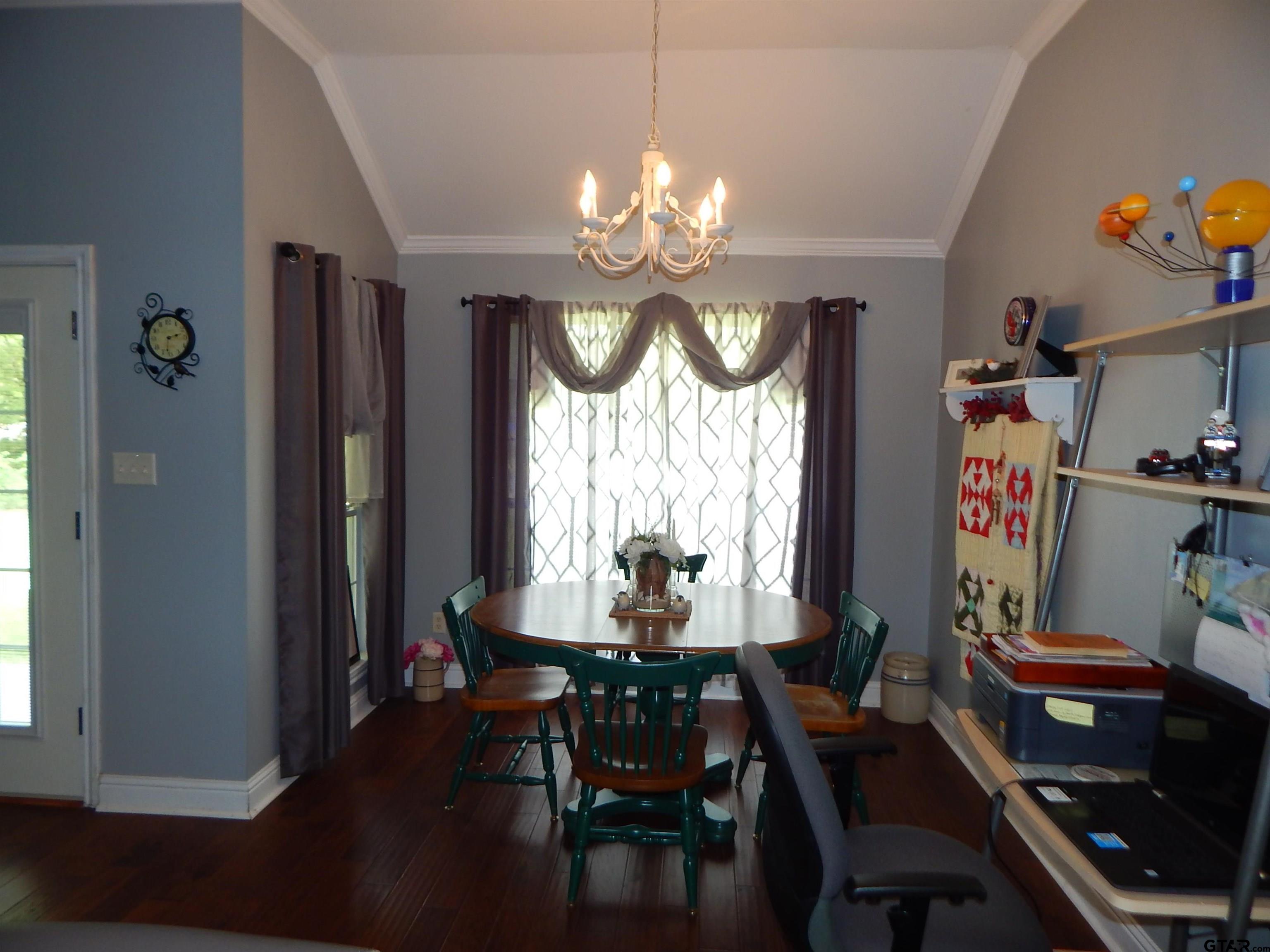1106 Tall Timbers Road Gilmer, TX 75645 - Photo 8 of 28 a view of a dining room with furniture window and wooden floor