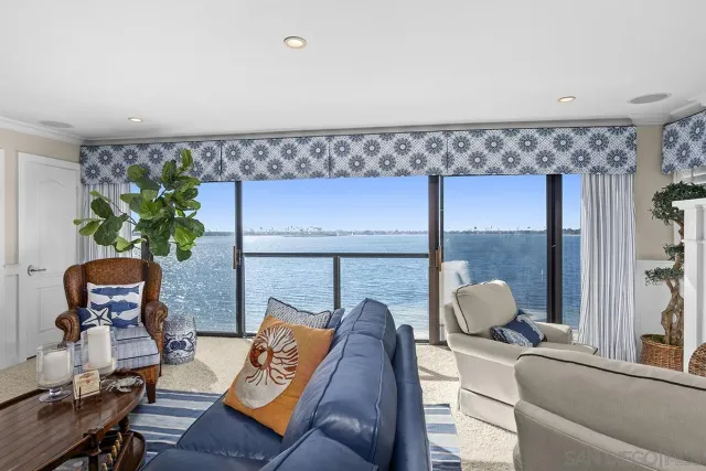 a kitchen with stainless steel appliances granite countertop a sink refrigerator and cabinets