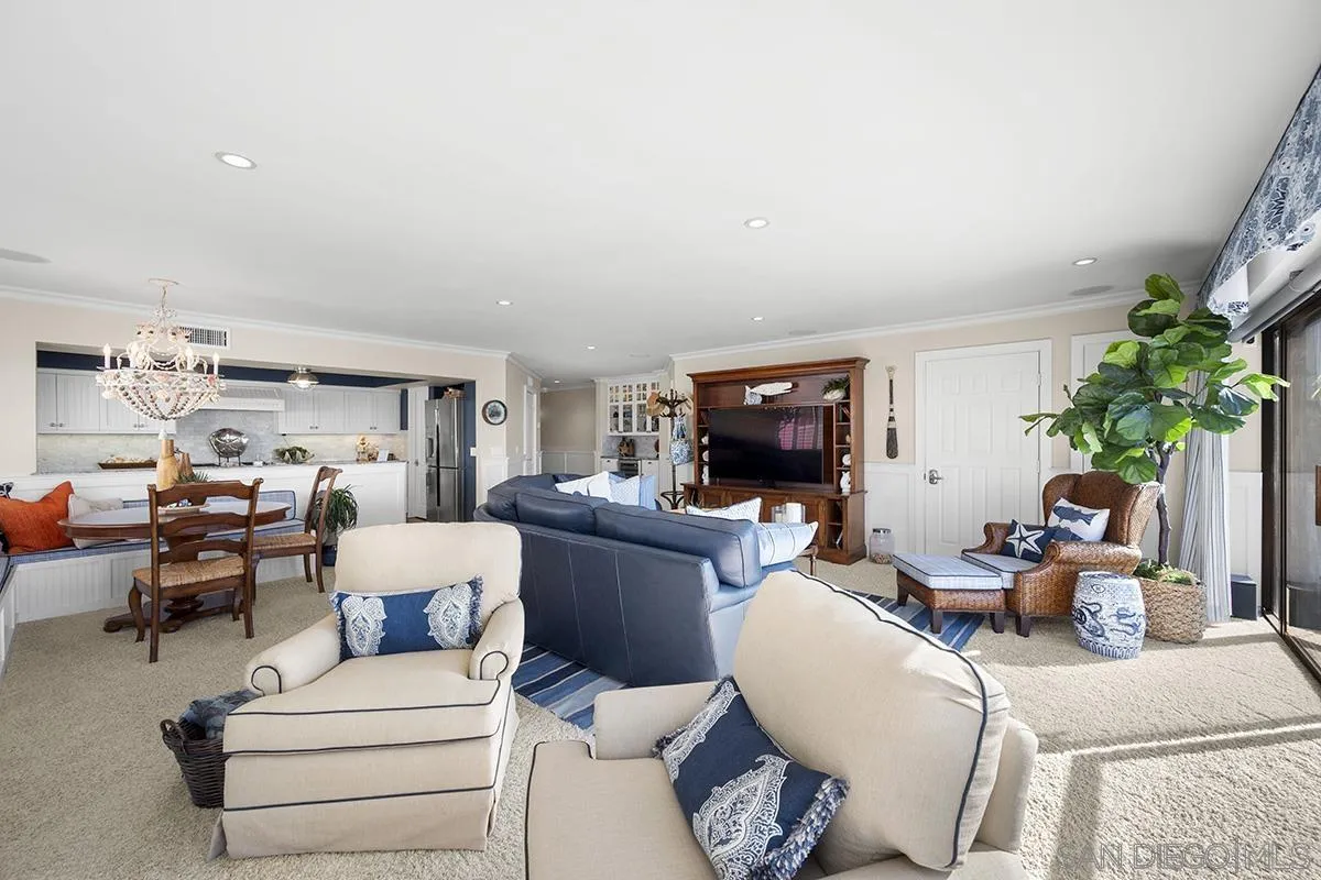 3828 Riviera Drive, Unit 2B San Diego, CA 92109 - Photo 23 of 74 a living room with furniture and a couch