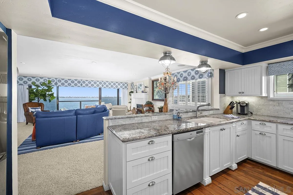 3828 Riviera Drive, Unit 2B San Diego, CA 92109 - Photo 29 of 74 a kitchen with a sink and cabinets