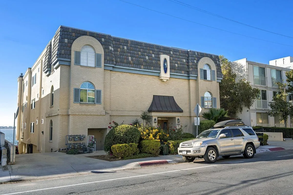 3828 Riviera Drive, Unit 2B San Diego, CA 92109 - Photo 3 of 74 a car parked in front of a house
