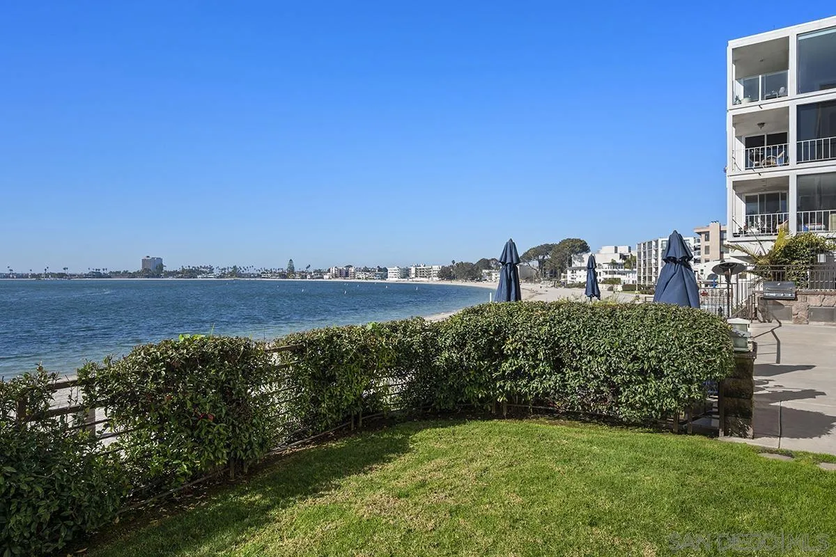 3828 Riviera Drive, Unit 2B San Diego, CA 92109 - Photo 54 of 74 a view of a lake with a building in the background
