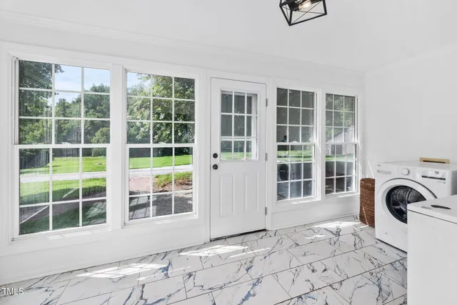 a spacious bathroom with a double vanity sink mirror and toilet