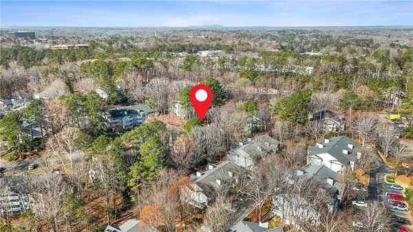 a view of a houses with green field