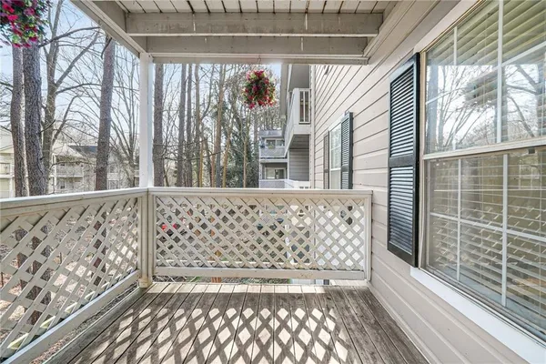 a view of a black and white wall with a large window