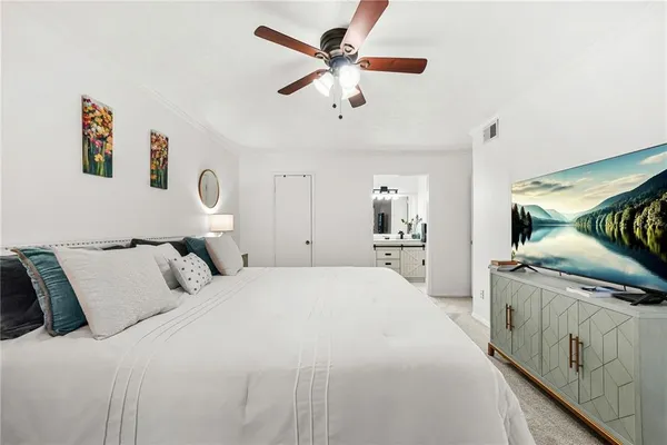 a bedroom with bed and window