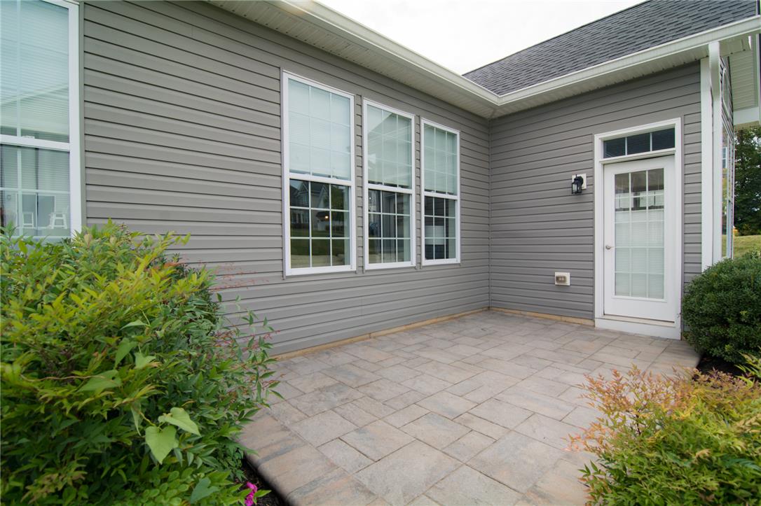 4097 Rutz Lane Allentown, PA 18104 - Photo 47 of 59 A spacious stone patio provides a private outdoor retreat framed by classic lap siding.