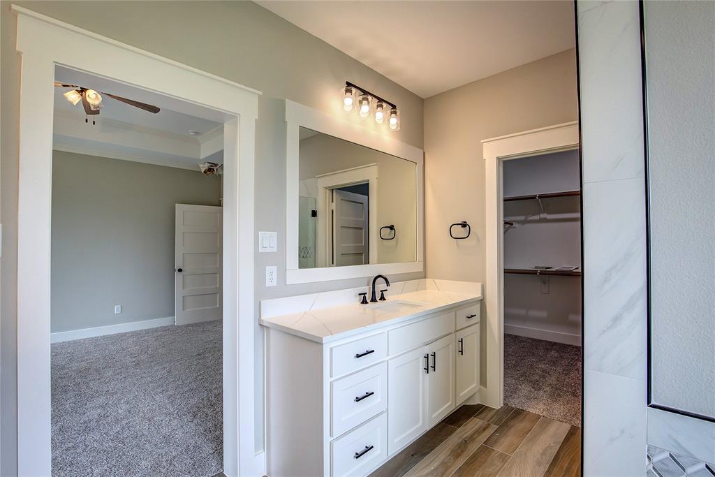 405 Door Key Ranch Road Trinidad, TX 75163 - Photo 21 of 30 a spacious bathroom with a double vanity sink and a mirror