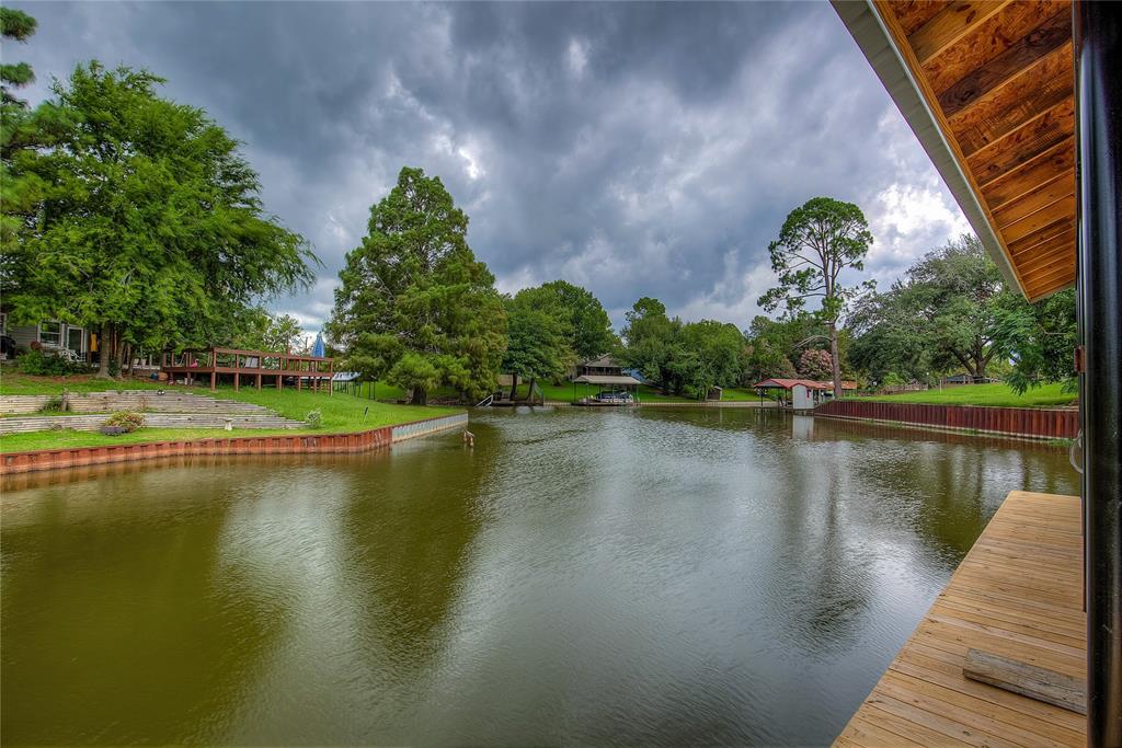 405 Door Key Ranch Road Trinidad, TX 75163 - Photo 3 of 30 a view of a lake with a house in the background