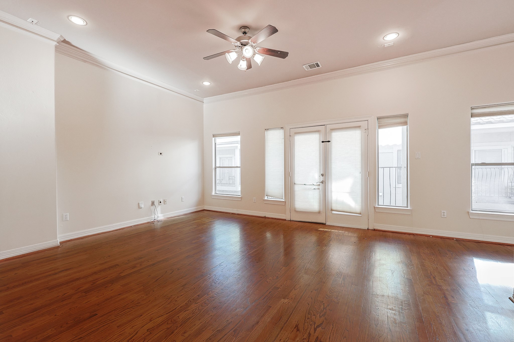 2540 Prospect Street, Unit C Houston, TX 77004 - Photo 4 of 31 a view of an empty room with wooden floor and a window