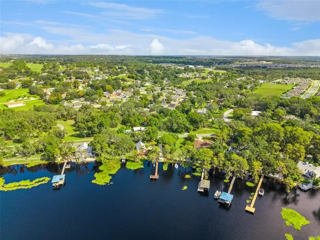 an aerial view of a houses with yard