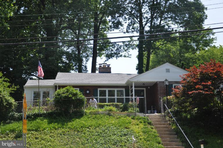 8311 Piney Branch Road Silver Spring, MD 20910 - Photo 22 of 23 a view of a house with a yard and potted plants