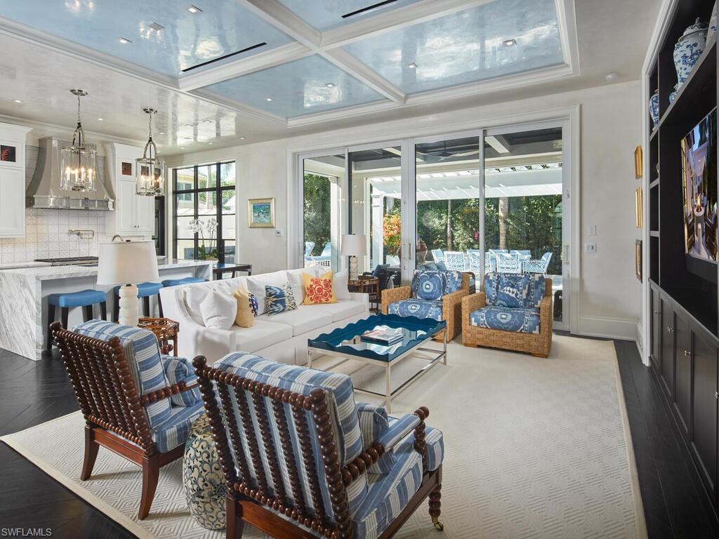 167 4th Street North Naples, FL 34102 - Photo 3 of 33 a living room with furniture and a large window