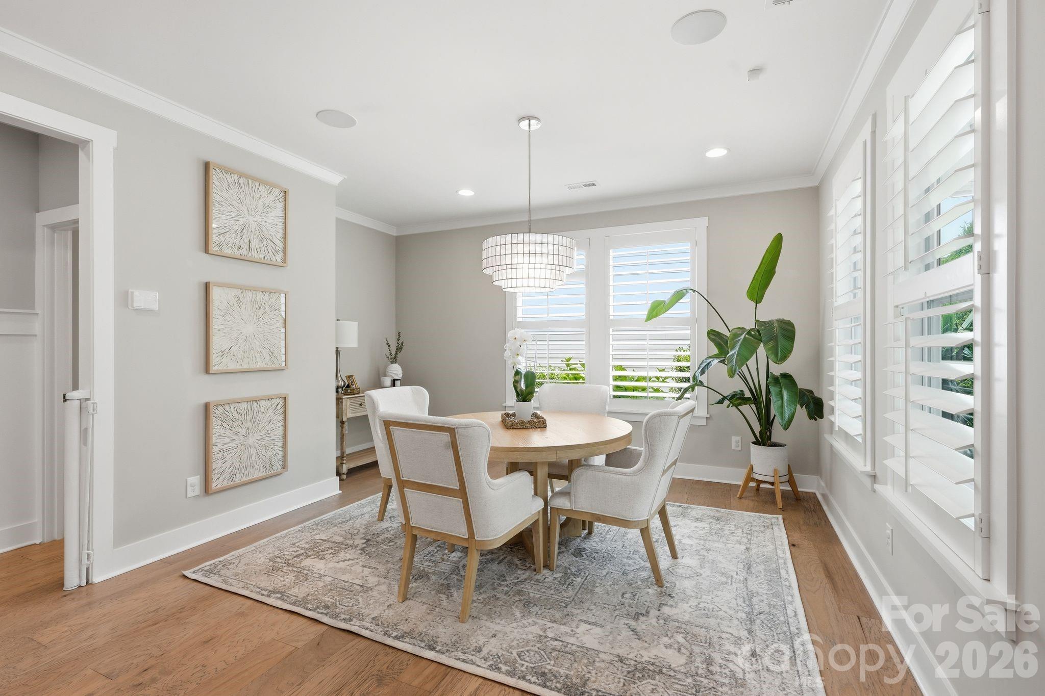 1086 Weir Court Fort Mill, SC 29708 - Photo 12 of 40 a view of a dining room with furniture window and wooden floor