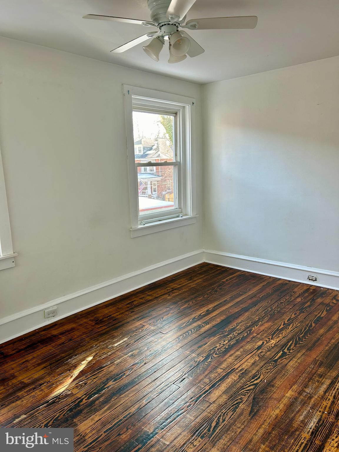 133 East Main Street Pottstown, PA 19465 - Photo 11 of 21 a view of an empty room with wooden floor and a window
