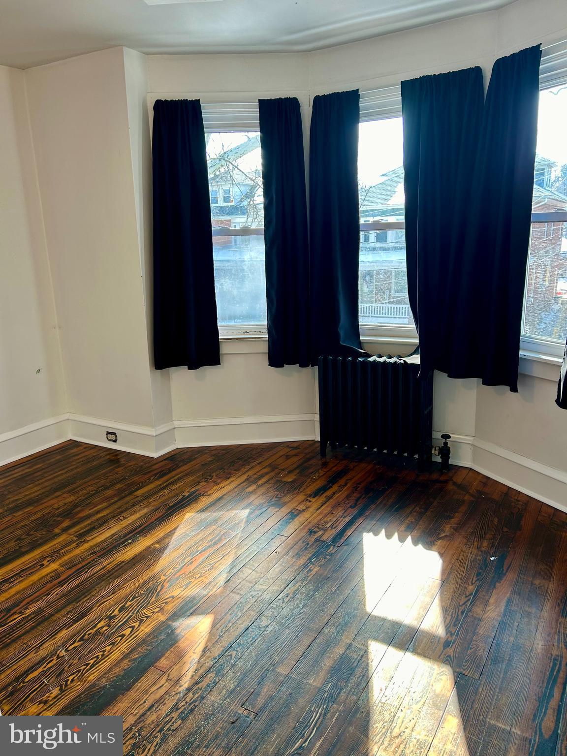 133 East Main Street Pottstown, PA 19465 - Photo 14 of 21 a view of a bedroom with wooden floor and a window