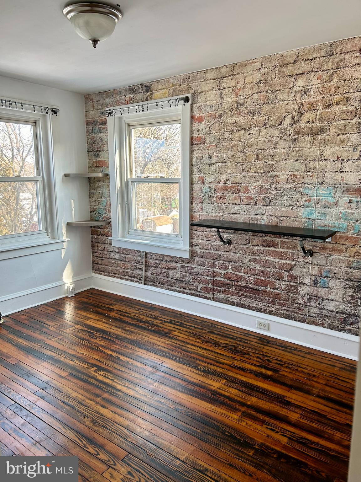 133 East Main Street Pottstown, PA 19465 - Photo 10 of 23 wooden floor in an empty room with a window