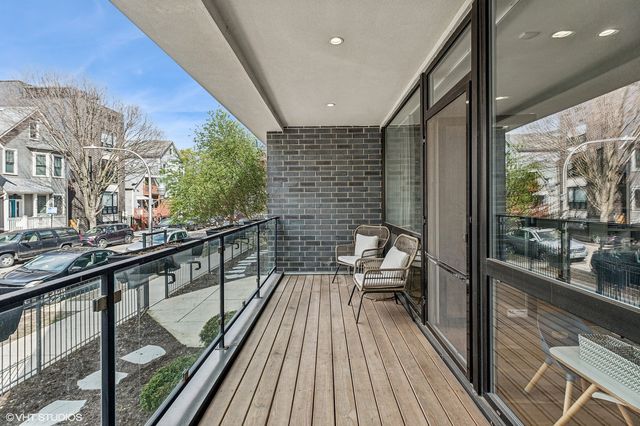a view of balcony with furniture