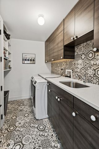 a view of house with swimming pool outdoor seating