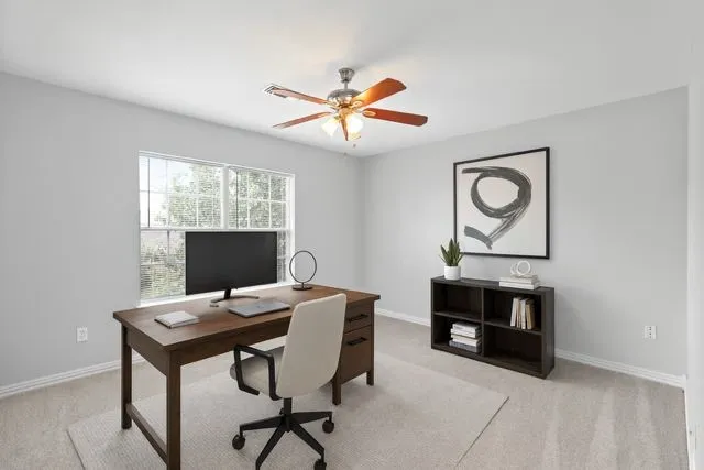 a work room with furniture and a window