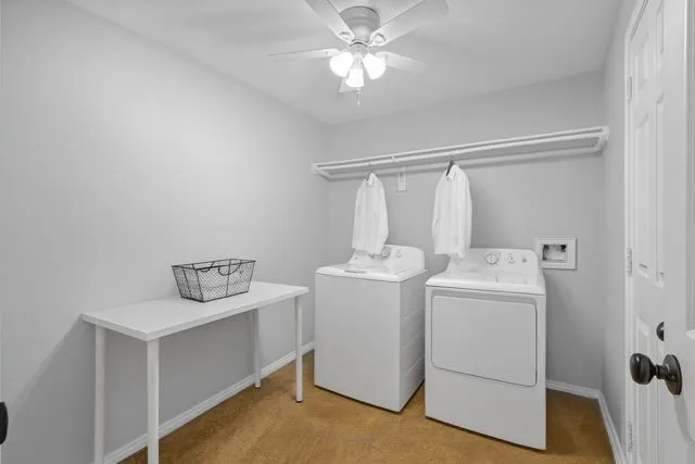 a view of storage and utility room with washer and dryer