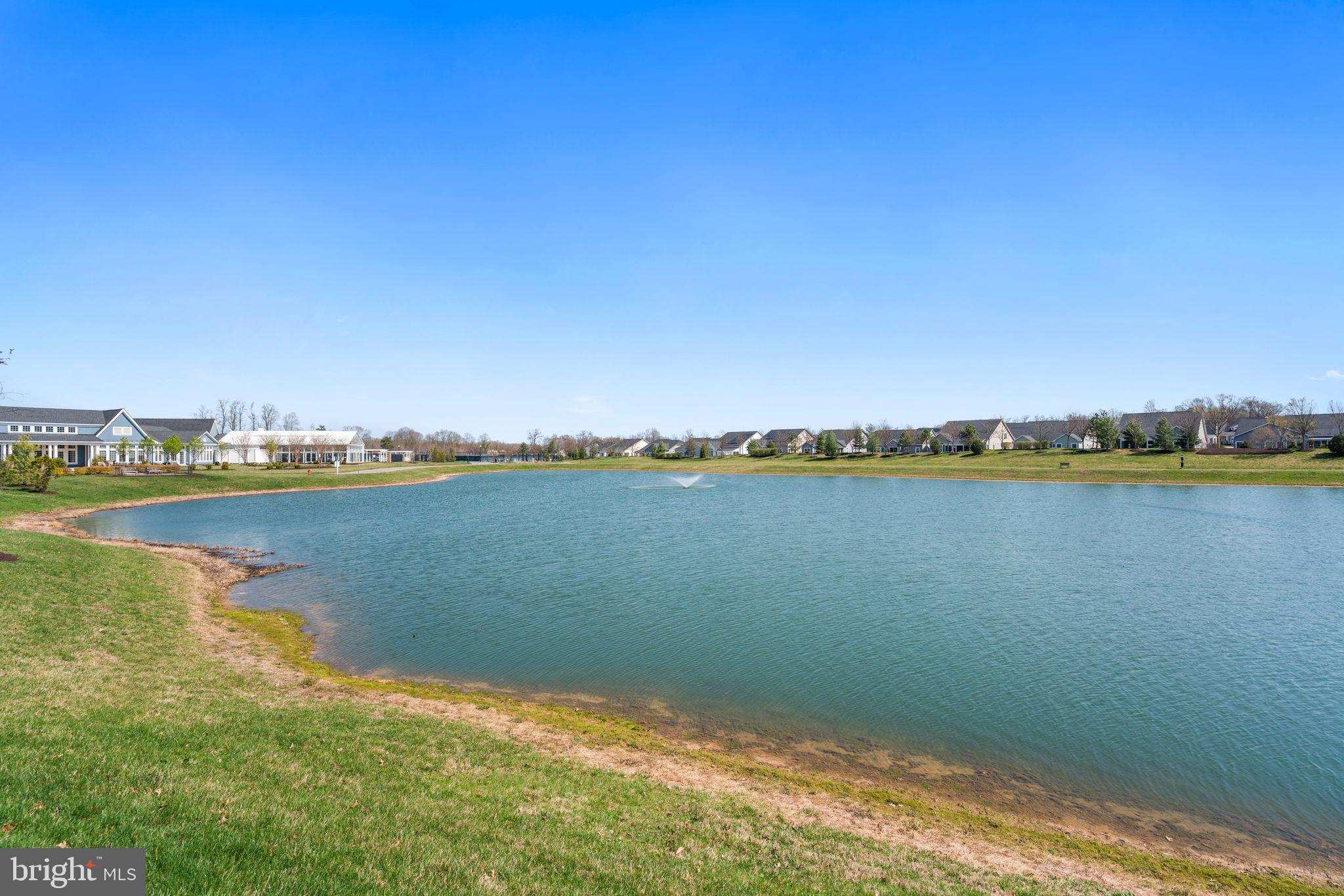 2916 Quarry Circle Odenton, MD 21113 - Photo 53 of 60 Serene lakeside view under blue skies.
