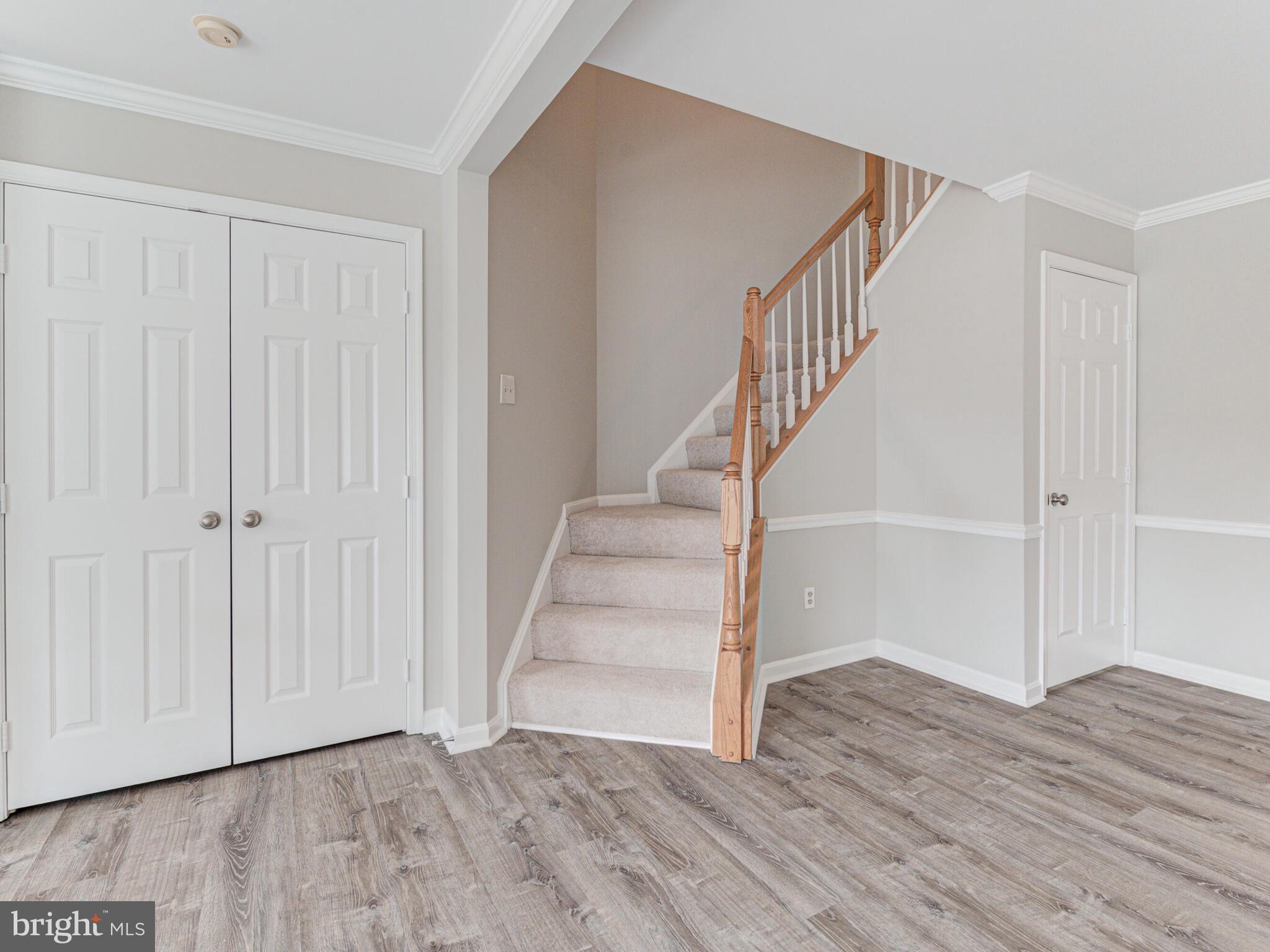 21140 Dray Terrace Ashburn, VA 20147 - Photo 22 of 59 Large Coat Closet & 2 Story Stairwell to Bedrooms